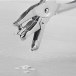 Picture of a single hole punch as an illustration of sitting on a toilet too long